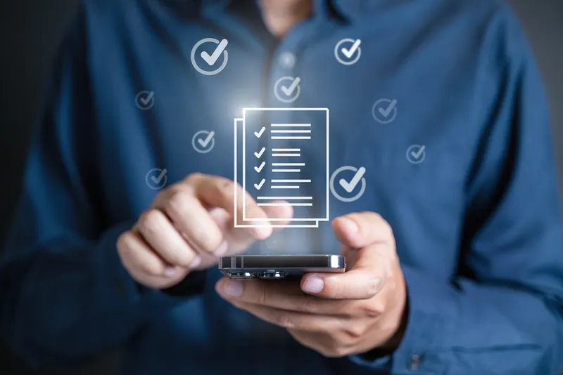 A client approving an inspection report on a phone